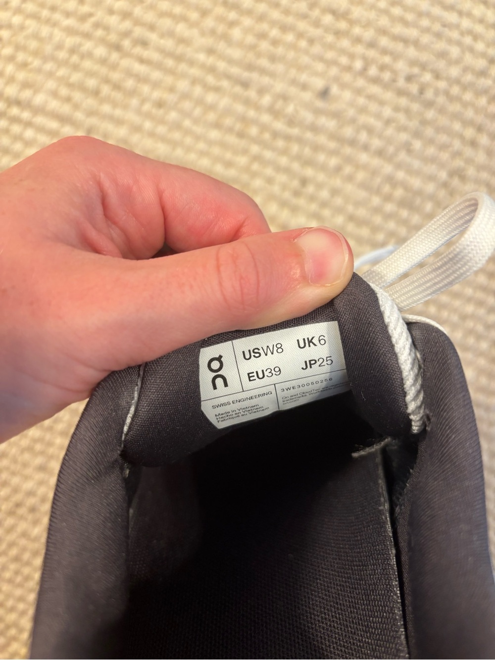 On Running womens Cloudsurfer Next shoes in White with Orange Accents - Picture 5 of 5
